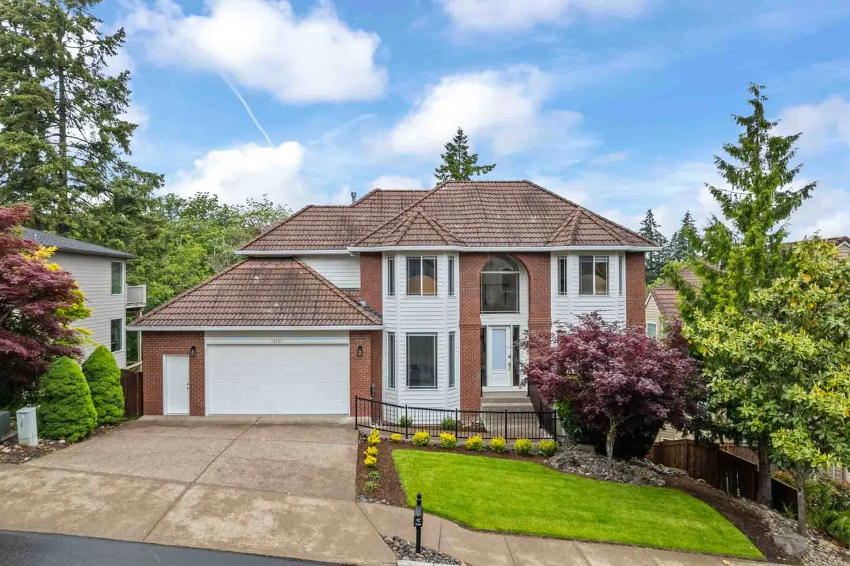 This image captures the inviting front entrance of Morningstar Manor, surrounded by a landscaped yard and a driveway. The well-maintained greenery and welcoming ambiance convey a sense of arrival and community.